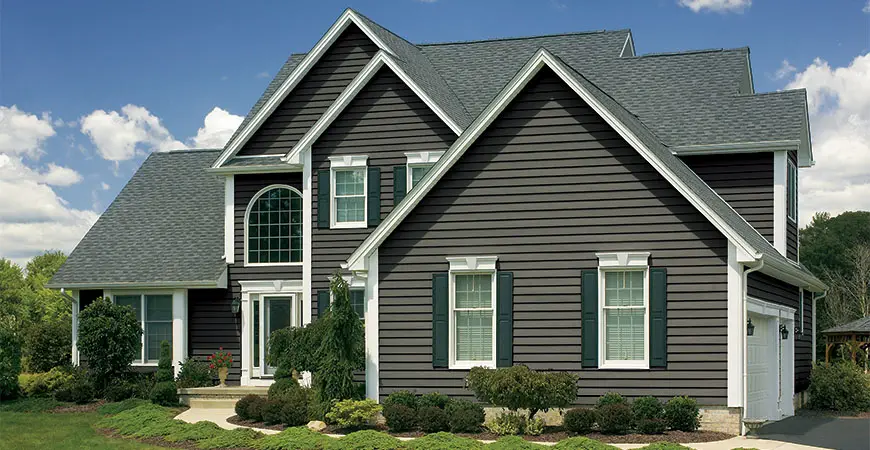 Beautiful grey home with new siding by the Window Source of West Texas