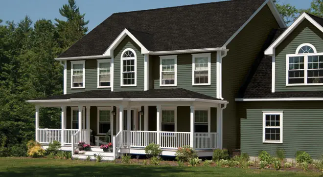 Grey home with siding by the Window Source of West Texas